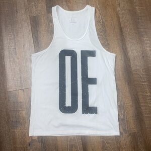 VINTAGE JINCO WHITE RACERBACK TANK TOP WHITE WITH OE IN BLACK ON FRONT SIZE LG